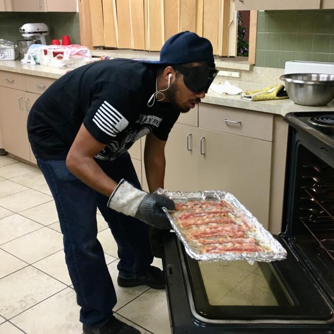 Taking bacon out of a hot oven